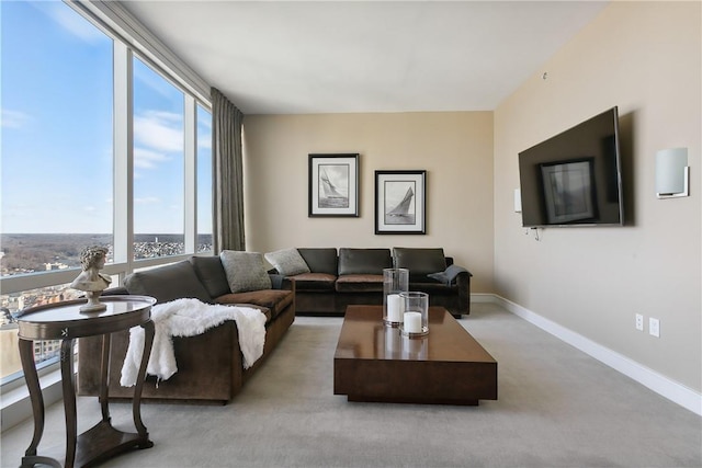 carpeted living room featuring plenty of natural light