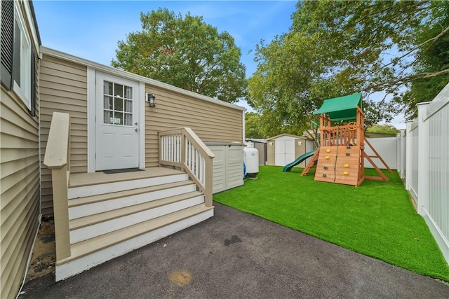 property entrance with a lawn