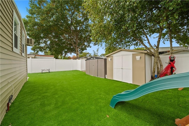 view of yard featuring a storage unit