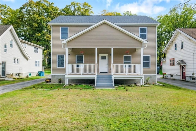 view of front of home featuring a porch and a front yard