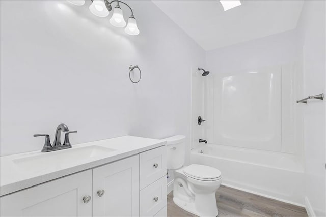 full bathroom featuring shower / bathing tub combination, vanity, hardwood / wood-style flooring, and toilet