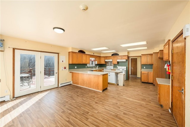 kitchen with a baseboard radiator, light hardwood / wood-style flooring, a kitchen bar, a kitchen island, and white stove