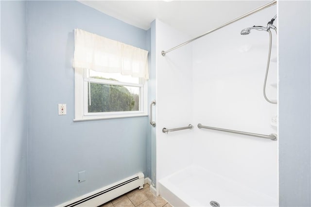 bathroom featuring tile patterned floors, baseboard heating, and walk in shower