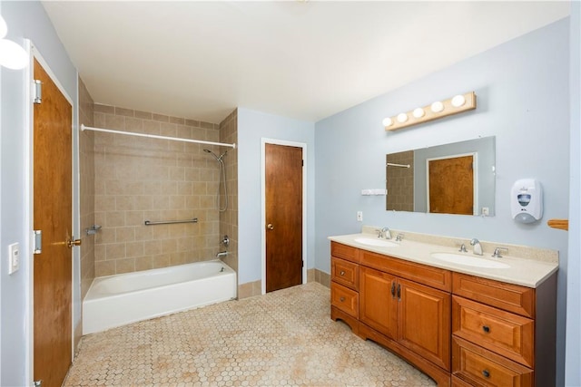 bathroom with vanity and tiled shower / bath combo