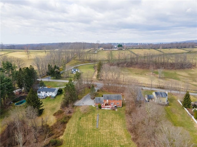 birds eye view of property with a rural view