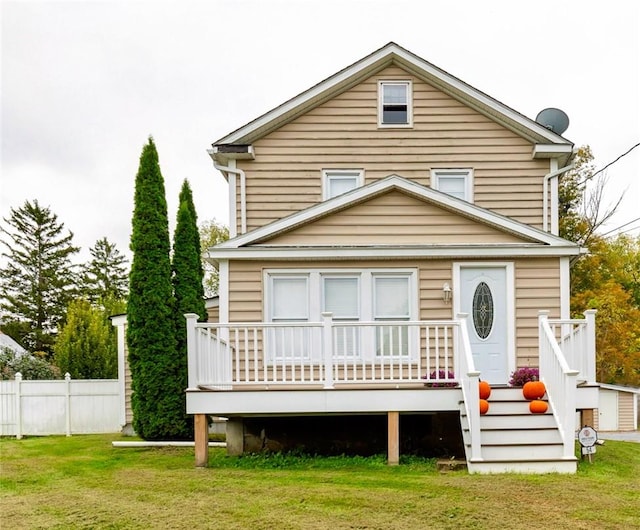 back of property featuring a lawn