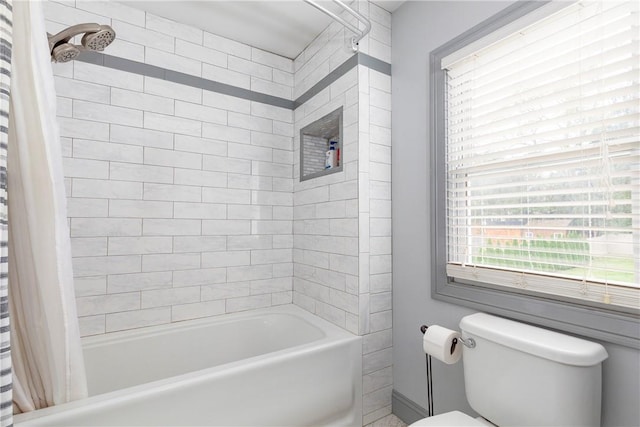 bathroom with shower / bathtub combination with curtain and toilet