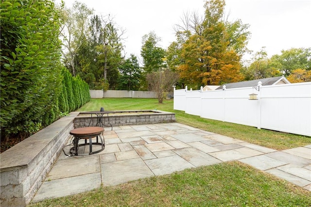 view of patio with a fire pit