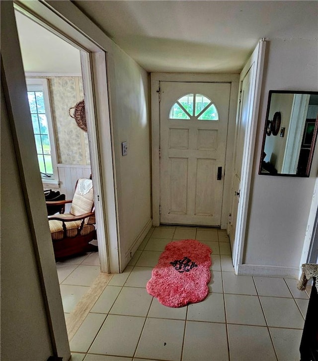 tiled entryway featuring a healthy amount of sunlight