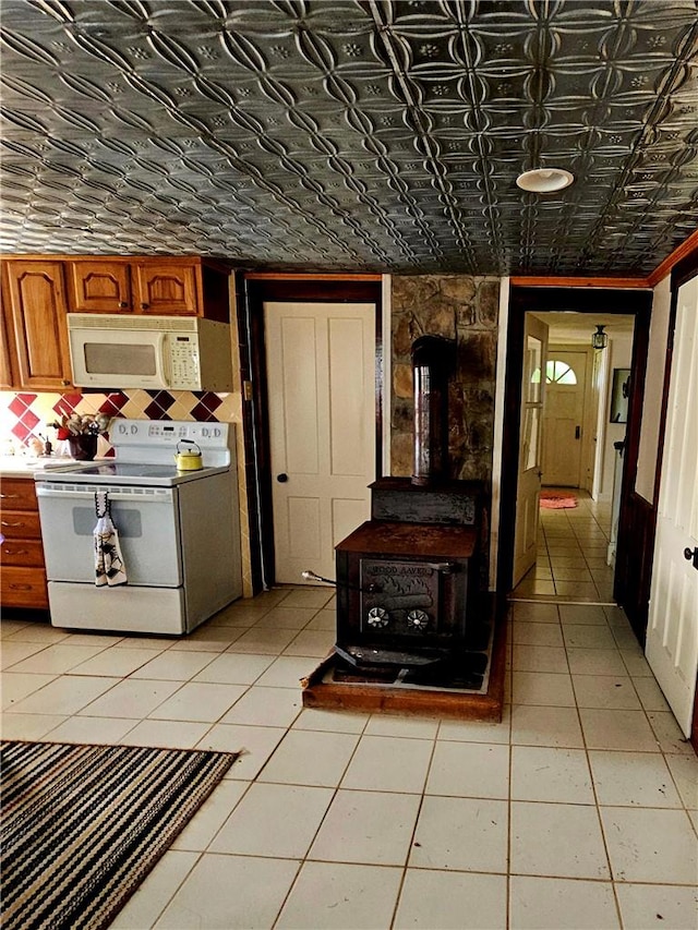 kitchen featuring white appliances and light tile patterned floors