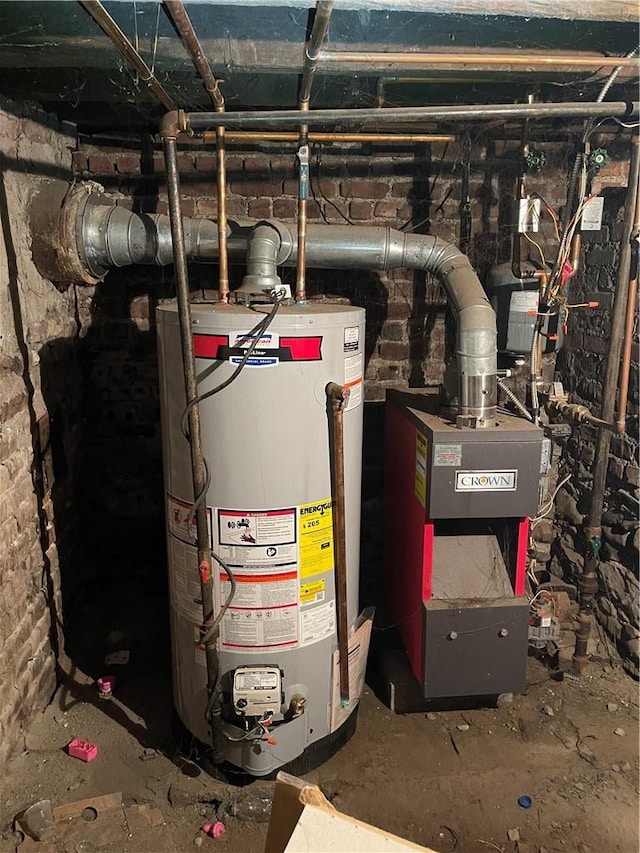 utility room featuring gas water heater