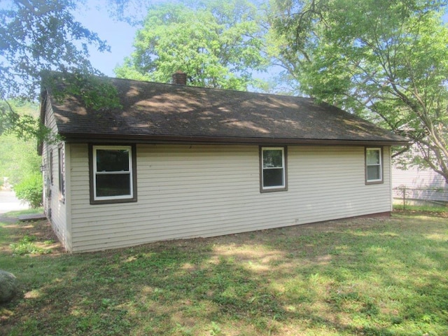 view of home's exterior featuring a lawn