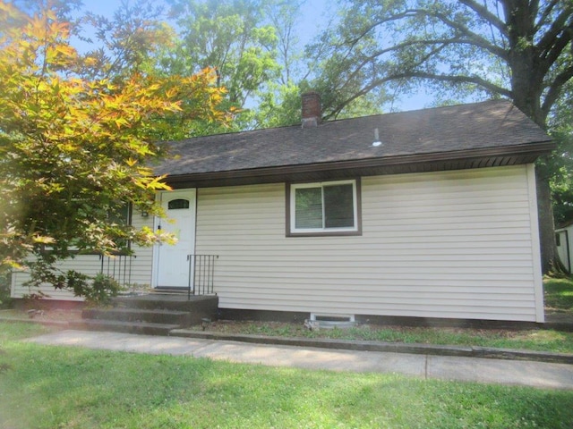 exterior space with a yard