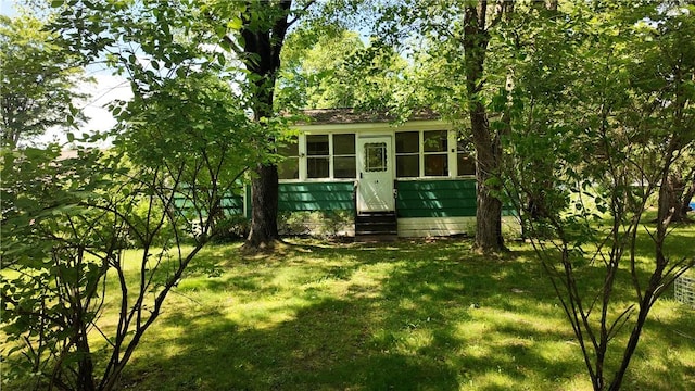 view of outbuilding with a yard