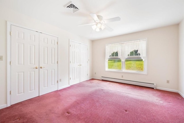 unfurnished bedroom featuring multiple closets, ceiling fan, a baseboard radiator, and light carpet