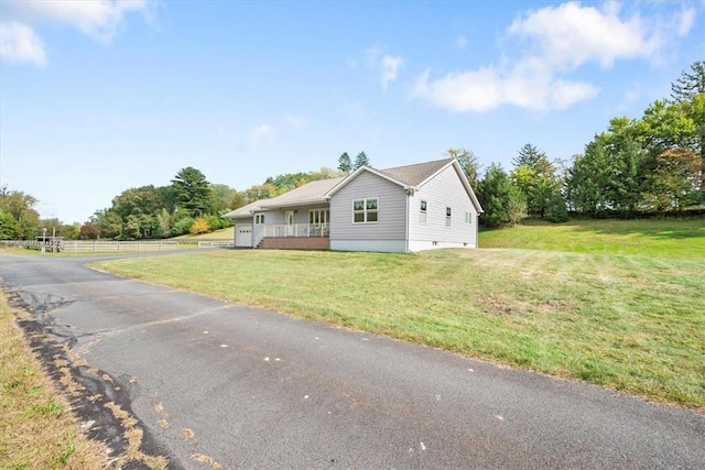 view of front of home featuring covered porch and a front yard