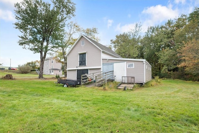 rear view of house with a lawn