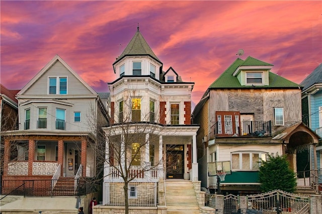 victorian home featuring a balcony