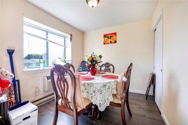 dining room featuring baseboard heating and dark wood-type flooring