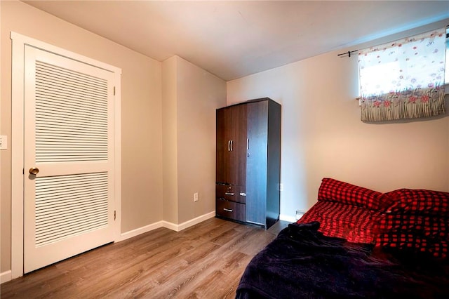 bedroom with hardwood / wood-style floors