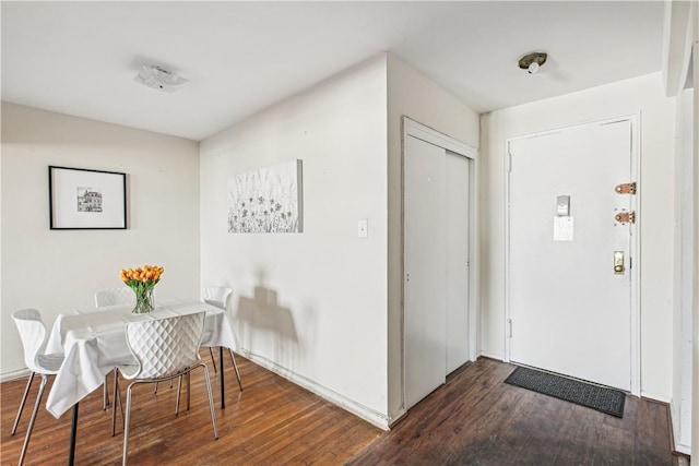 foyer with dark wood-type flooring