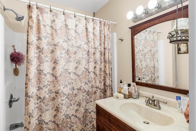 bathroom with a shower with curtain and vanity