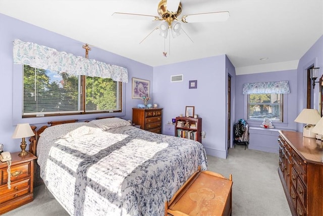 carpeted bedroom with ceiling fan