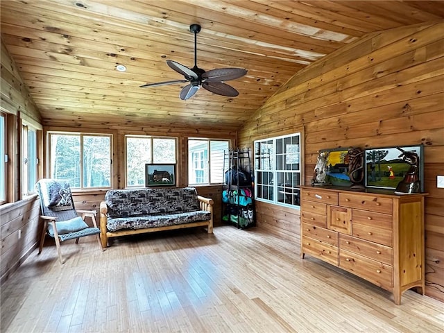 interior space with ceiling fan, wood ceiling, and vaulted ceiling