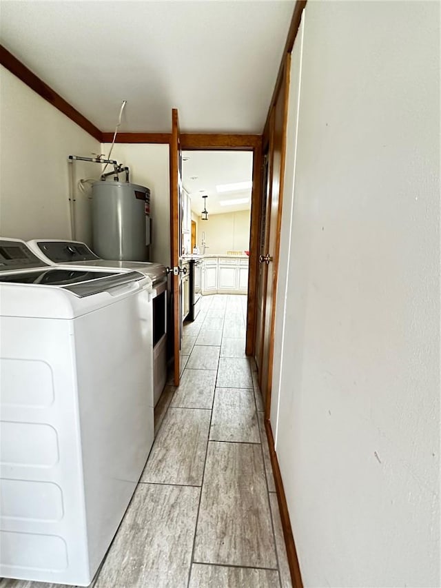 clothes washing area with washing machine and clothes dryer