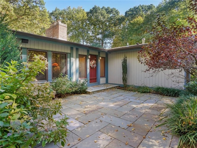 doorway to property featuring a patio area