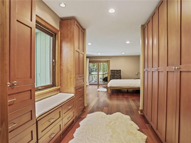 bedroom with dark hardwood / wood-style floors