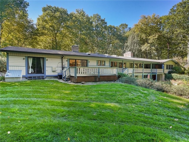 rear view of house with a yard