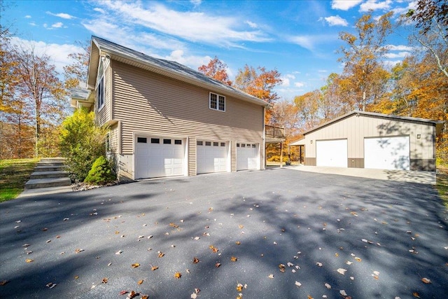 view of side of home featuring a garage