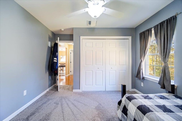 unfurnished bedroom with carpet flooring, a closet, and ceiling fan