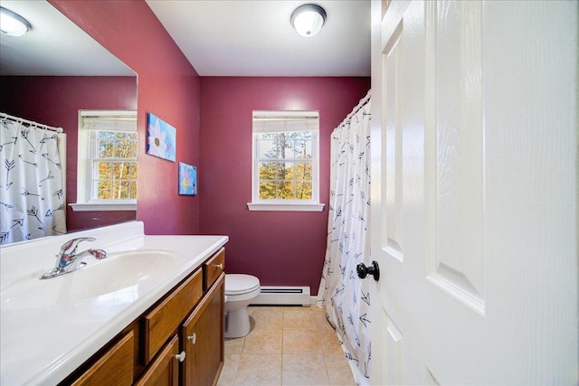 bathroom with tile patterned flooring, vanity, toilet, and a baseboard heating unit