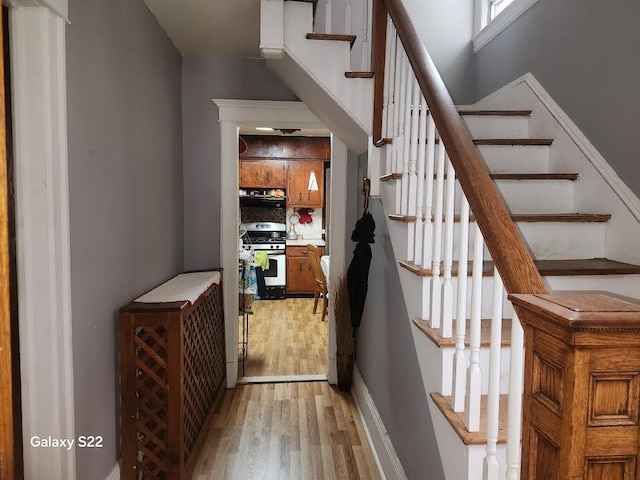 staircase featuring hardwood / wood-style flooring