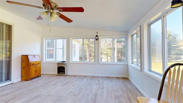 unfurnished sunroom featuring ceiling fan and lofted ceiling