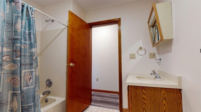 bathroom with vanity, wood-type flooring, and shower / tub combo with curtain