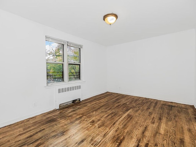 144 Ravine Ave Unit 2C, Yonkers, NY 10701 - empty room featuring radiator heating unit, wood finished floors, and baseboards