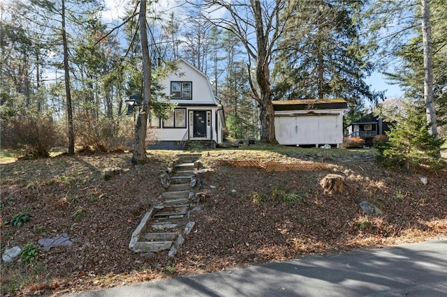 view of front facade featuring a storage unit