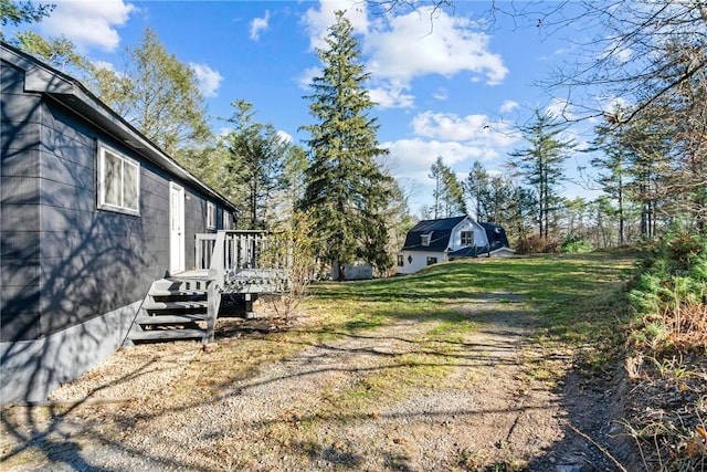 view of yard with a wooden deck