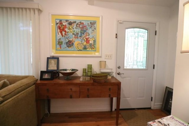 doorway to outside featuring dark hardwood / wood-style floors