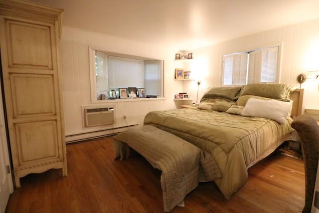 bedroom featuring a wall mounted air conditioner, dark hardwood / wood-style flooring, and baseboard heating