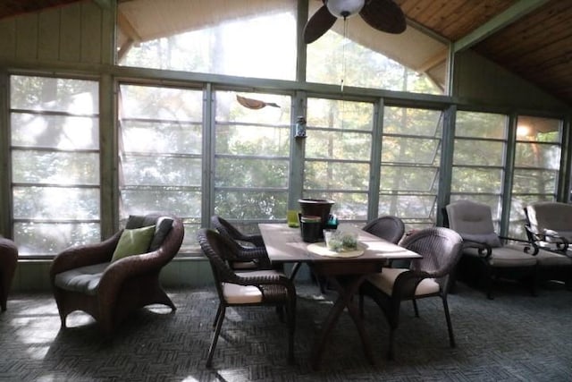 sunroom / solarium featuring ceiling fan, wood ceiling, and lofted ceiling