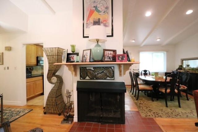 living room with hardwood / wood-style flooring and beamed ceiling