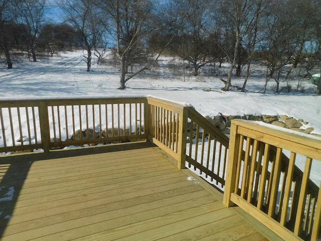 view of snow covered deck