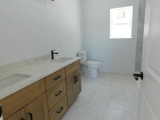 bathroom featuring toilet and vanity