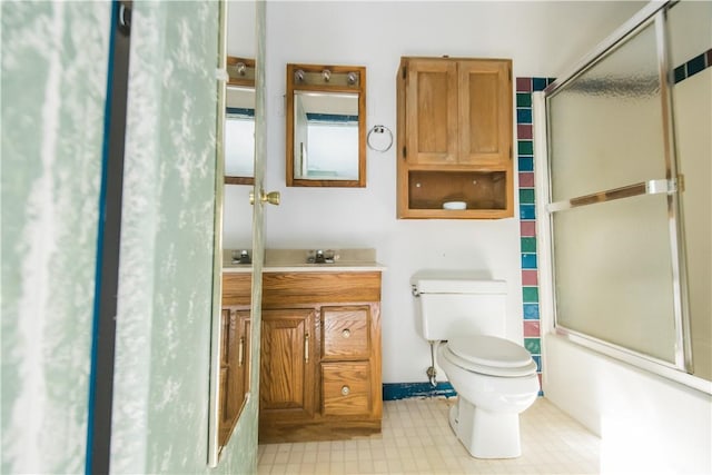 full bathroom with vanity, toilet, and enclosed tub / shower combo