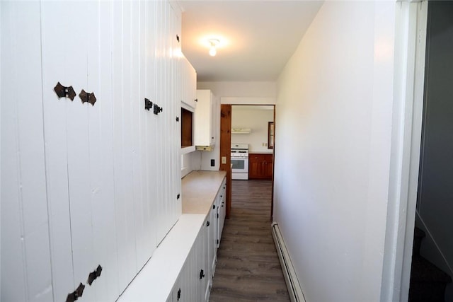 hall featuring dark hardwood / wood-style floors and a baseboard radiator