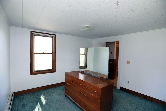 unfurnished bedroom featuring a baseboard radiator and dark carpet